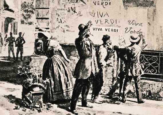 Italians writing Viva Verdi on the wall