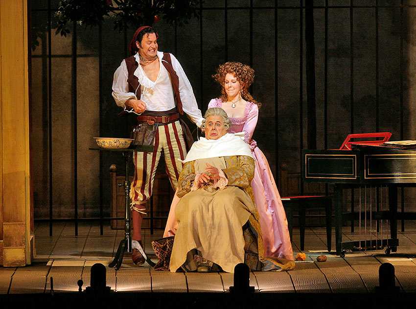 The Barber of Seville gets some help from Rosina preparing Doctor Bartolo for a shave, in Bartlett Sher’s Metropolitan Opera production © Ken Howard/Metropolitan Opera